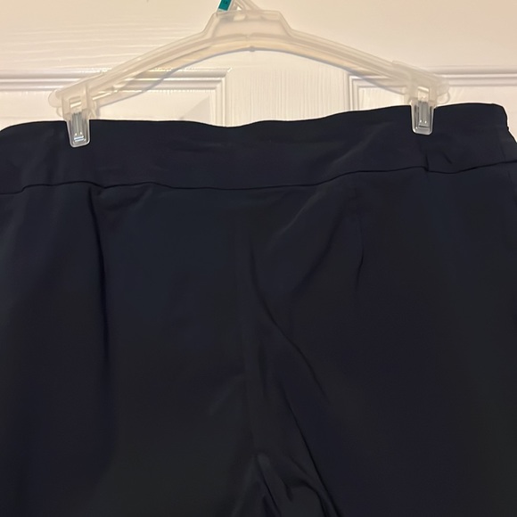 Navy blue stretch slacks with gold studs at ankle. - Picture 6 of 6